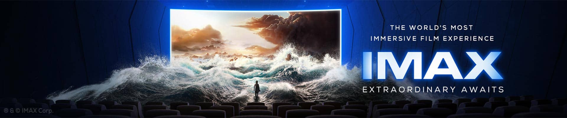 IMAX banner with giant screen and waves in a theater